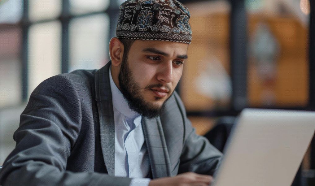 A NurVerse Quran tutor teaching a live online lesson on his laptop